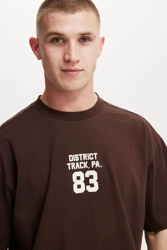 Cotton On Graphic TShirts Box Fit College TShirt Dark Oakdistrict Track 8211 Men Cotton On Graphic TShirts Box Fit College TShirt Dark Oakdistrict Track 8211 Men