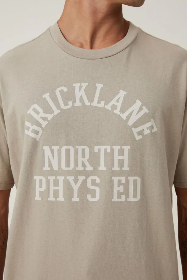 Cotton On Tees and Tanks Loose Fit College TShirt Gravel Stone Bricklane Phys Ed 8211 Men Cotton On Tees and Tanks Loose Fit College TShirt Gravel Stone Bricklane Phys Ed 8211 Men